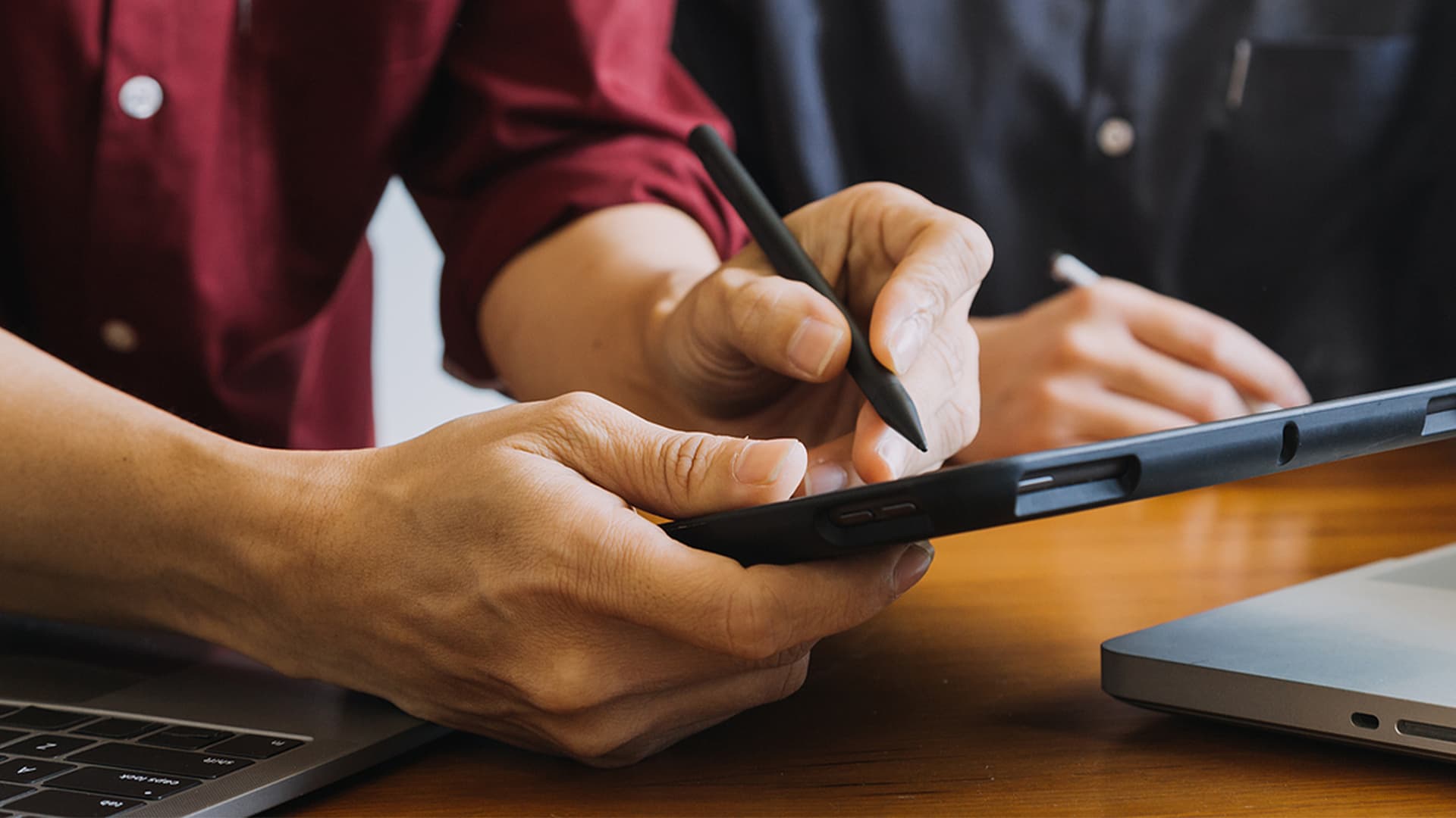 Close up of tablet being used with a stylus