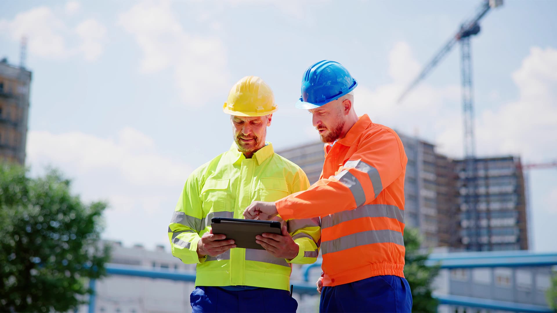 Contractors check their CRM on a tablet