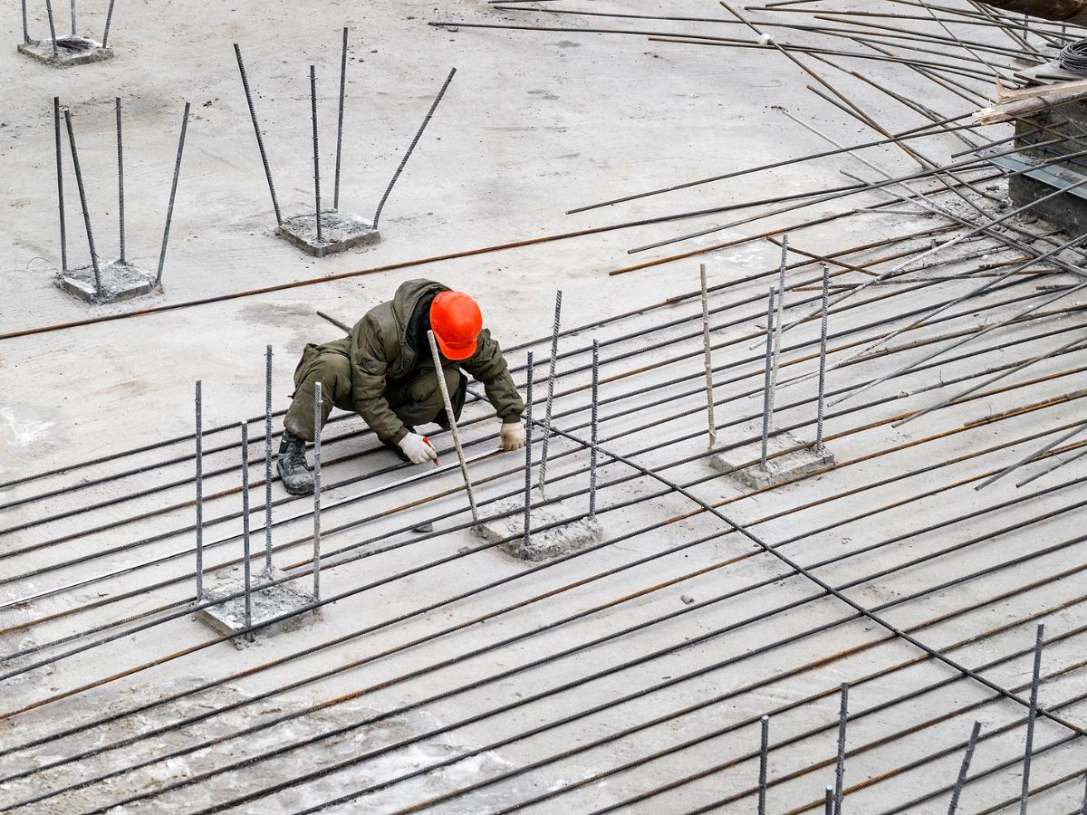 A construction worker helping to restore a building.